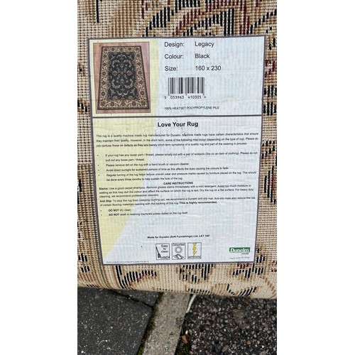 565 - LARGE BLACK OVER FLOOR RUG 7 X 4 ft