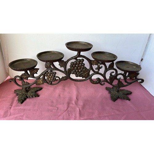 23 - CAST METAL CANDLE STAND...