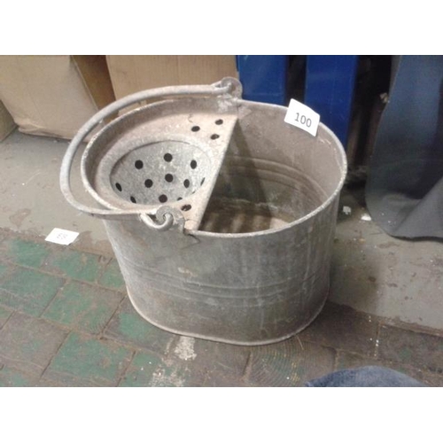 100 - Old galvanised mop bucket