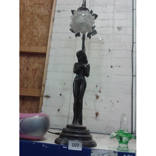 107 - Large bronzed look nude female form table lamp with floral glass shade (broken fitting)