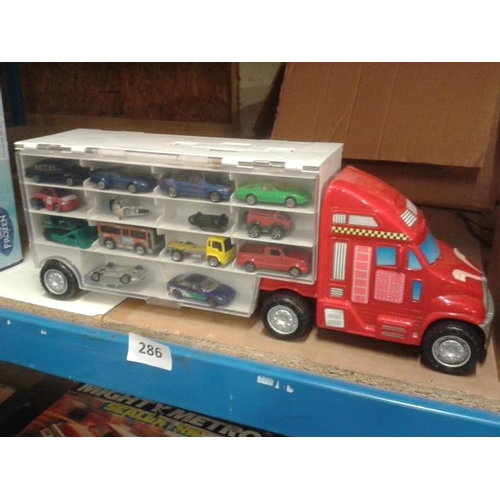 286 - Toy car transporter with assorted toy cars