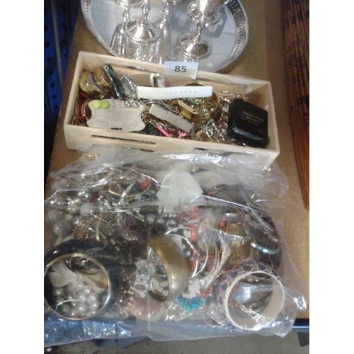 85 - Box and bag of assorted fashion jewellery