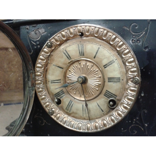 213 - Victorian Ansonia Clock Company, black enamelled iron mechanical clock with spelter lion sides