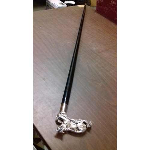 117 - Ebony walking stick with white metal big cat handle