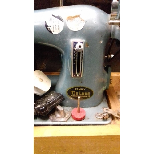 152 - Delso sewing machine co family delux model sewing machine and foot pedal with rhyl plaque