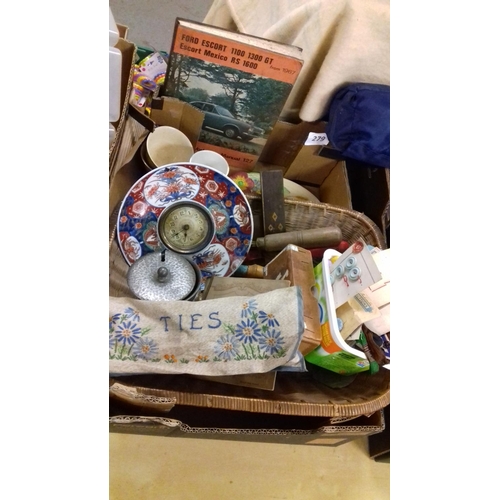 297 - Basket of assorted miscellaneous inc' old ford escort book etc