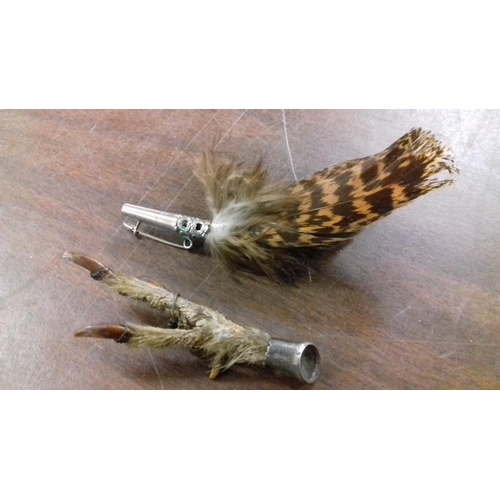 29 - Kestrels foot brooch with white metal mount & other white metal real feather brooch