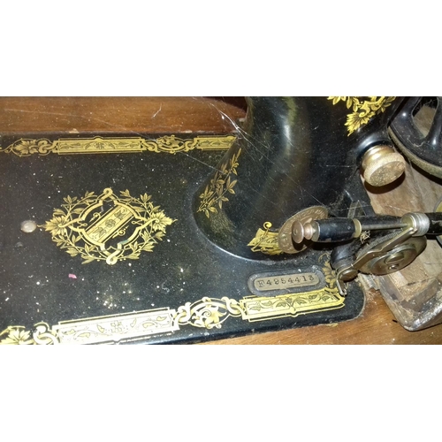 450 - Singer treadle sewing machine in table serail number f4954413