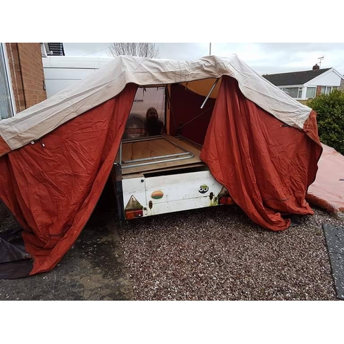 309A - 4 x 4ft conway? trailer tent with spare wheel and awning. usual wear but guaranteed watertight