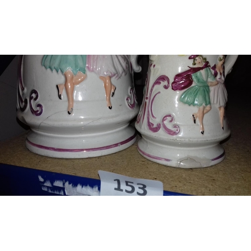 141 - Graduated pair of victorian lustre jugs with embossed lozenge mark. some damage to both. largest bei... 