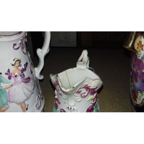 141 - Graduated pair of victorian lustre jugs with embossed lozenge mark. some damage to both. largest bei... 