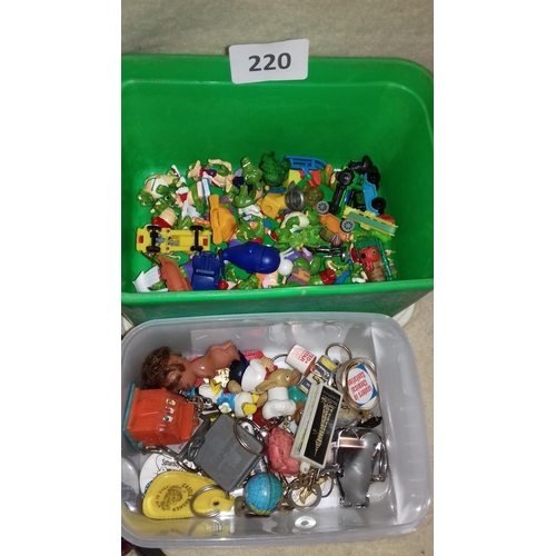 220 - Tub of assorted vintage and other novelty key rings, 4 x pin badges & tub of kinder egg surprises