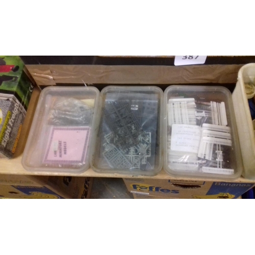 387 - Large amounts of assorted double o gauge and n gauge railway layout figures and accessories etc.