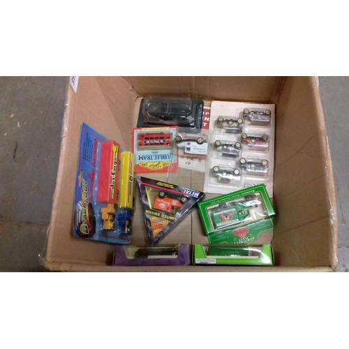 391 - 2 x boxes of assorted new and boxed or carded model cars and vans etc.