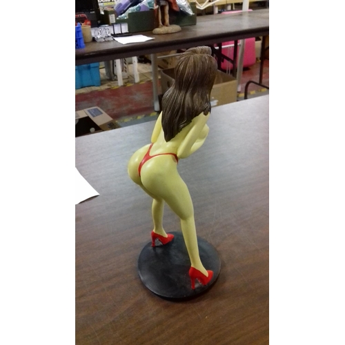 213 - Composite semi nude female figurine on base 28 cm tall