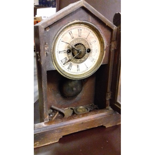 204 - Old black forest 31 cm tall mantle clock, non working and needing tlc but key and pendulum present