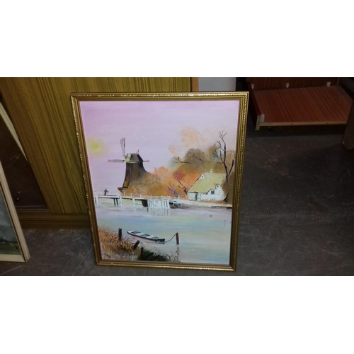 513 - Gilt framed 54 x 44 cm windmill by river scene painting on board, no visible signature