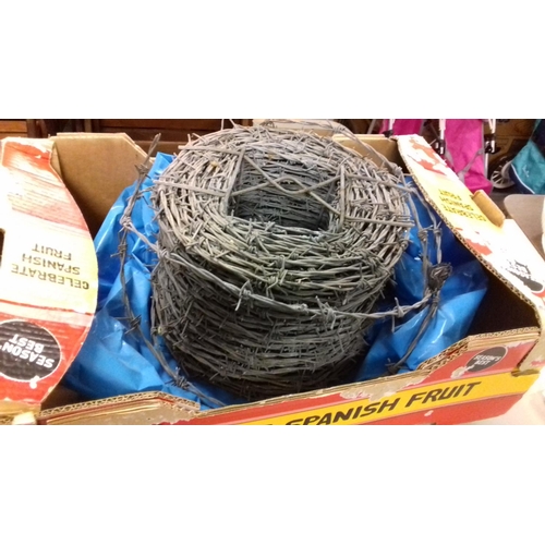 152 - Nearly full roll of barbed wire