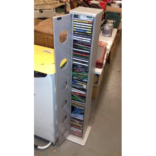 271 - Tower cd rack with door front and quantity of assorted cds