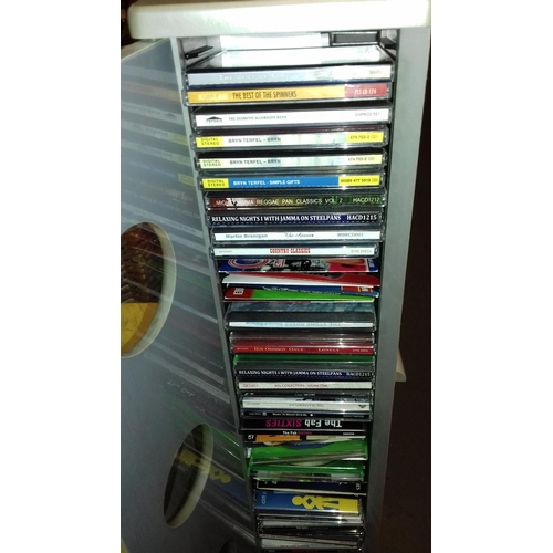 271 - Tower cd rack with door front and quantity of assorted cds