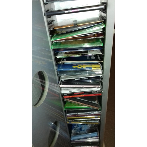 271 - Tower cd rack with door front and quantity of assorted cds