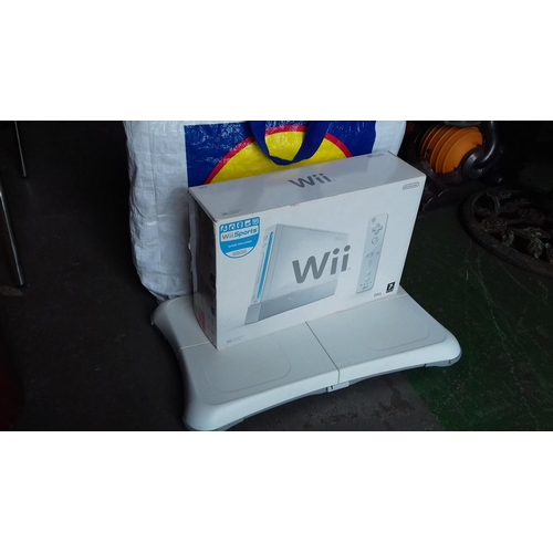 103 - Boxed wii games console with sports pack and wii fit board