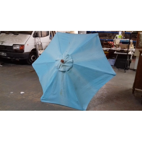 492 - Garden parasol and hard plastic base