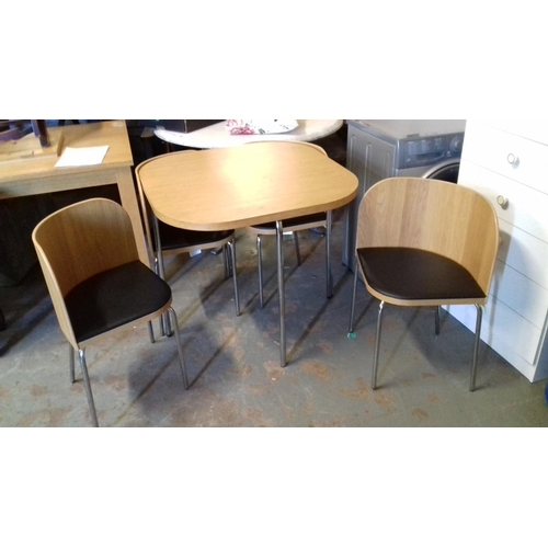 536 - Space saver light wood dining table and 4 tuck away chairs