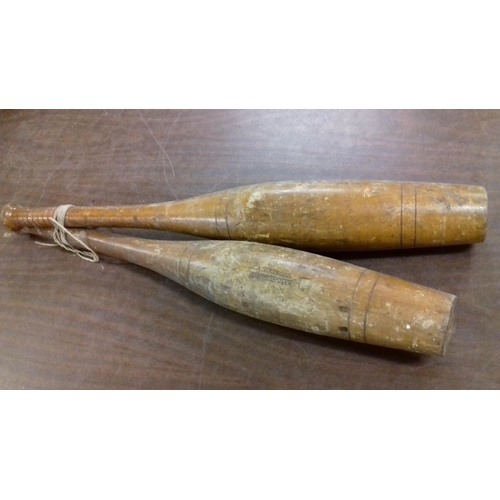 363 - Pair of vintage wooden jugglers clubs stamped A.Watson Manchester