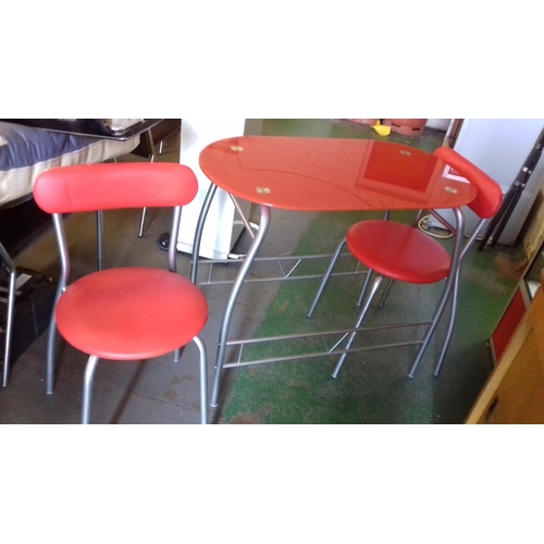 438 - 90 x 50 cm red glass rounded end space saver dining table and 2 x red leather under chairs