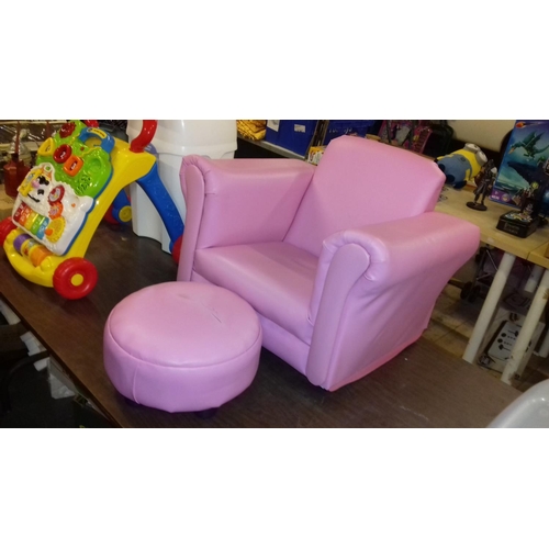 514 - Childs pink leather look rocking arm chair with matching footstool