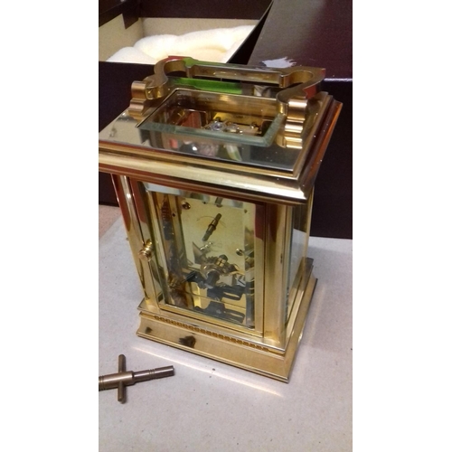 74 - Boxed Morrell and Hilton presentation mechanical carriage clock with skeleton back and winding key p... 