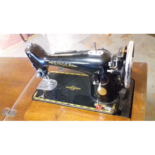 518 - Singer sewing machine in cabinet serial number EG579402