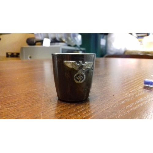 610 - Metal shot glass with WW2 german naval badge