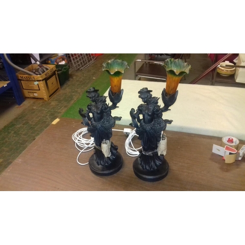 73 - Pair of composite figural fruit seller lamps, 1 with repaired damage, overall height (with shades) a... 