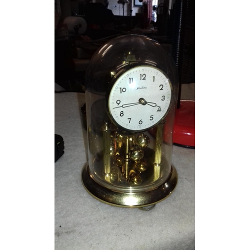 115 - Brass Bentima mechanical anniversary clock with plastic dome