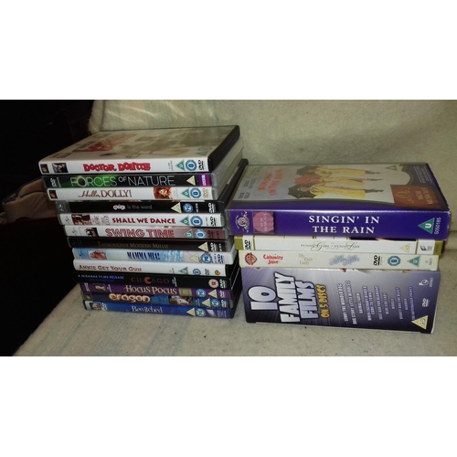 317 - Good bundle of assorted dvd films, box sets and singing in the rain vhs