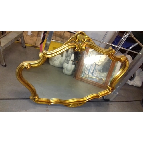 27 - Ornate gilt composite framed wall mirror approx. 90 x 70 cm