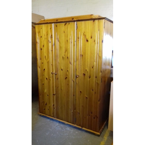 498 - 6 ft pine triple wardrobe approx 129 wide x 53 cm