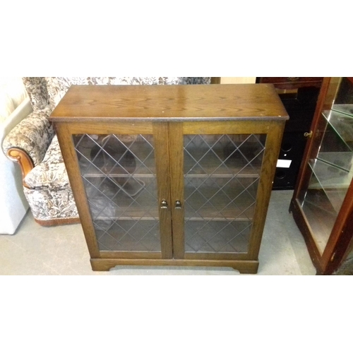 472 - 87 x 30 x 92 cm tall New Plan furniture ltd leaded glass front bookcase