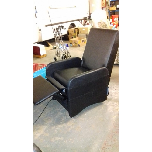 598 - Pair of black faux leather reclining chairs that convert to stool seats