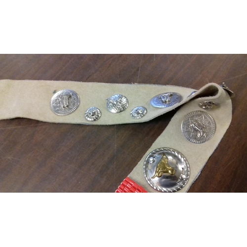 36 - Leather rodeo belt with badges attached