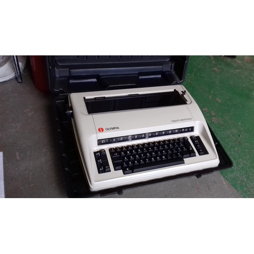 86 - Olympia Report electronic typewriter in hard plastic case but no power adapter