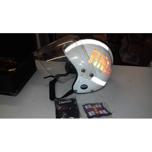 379 - RNLI helmet with visor, badge and pager wallet