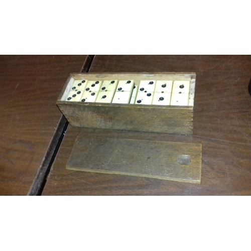 42 - Full set of bone and ebony dominoes in wooden case