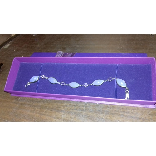 567 - Boxed silver and cloudy purple stone bracelet