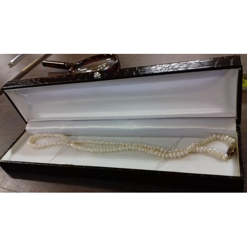 571 - Boxed natural pearl necklace