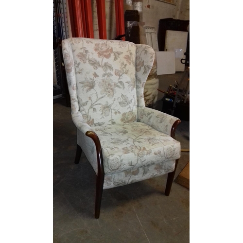 404 - Cream and beige floral patterned Parker Knoll wing back arm chair