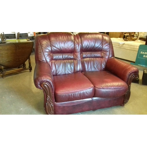 435 - Oxblood red faux leather 2 seater couch, scuffing on the rear corner