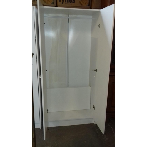 447 - 75 x 45 x 161 cm tall white wardrobe with shelves if required